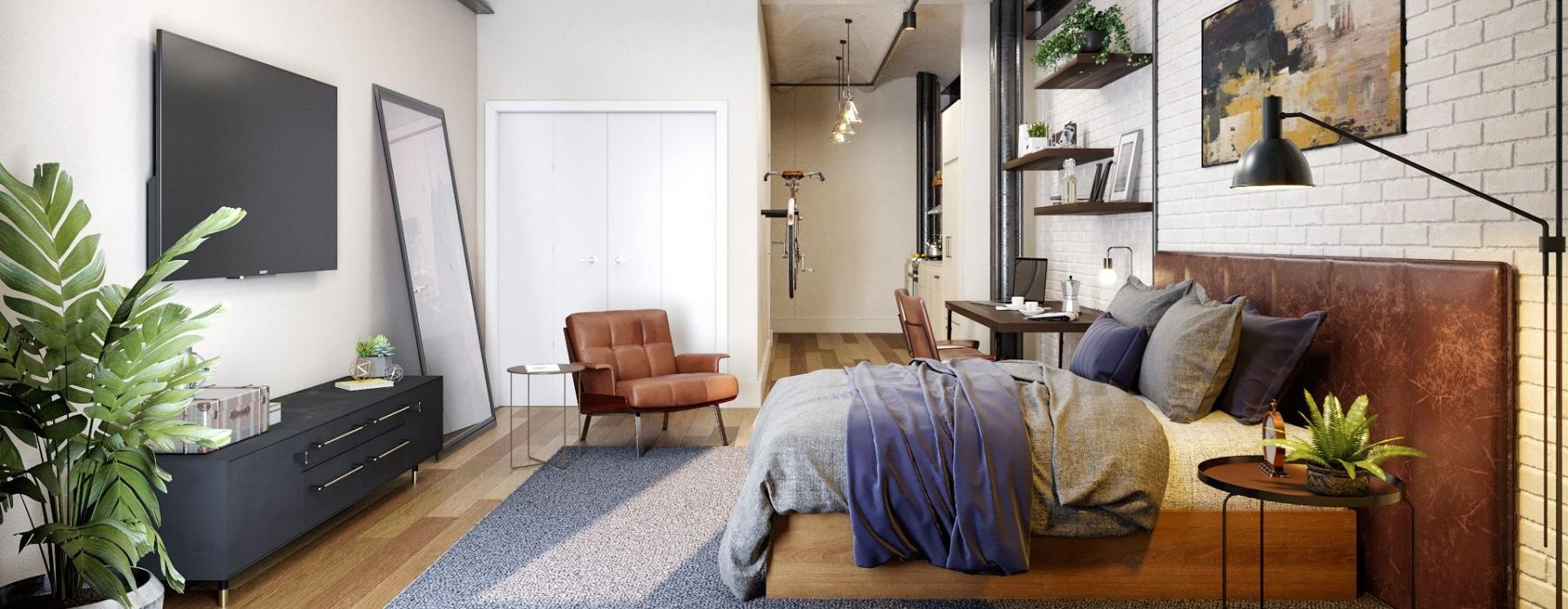a room with a bed and a tv and chair