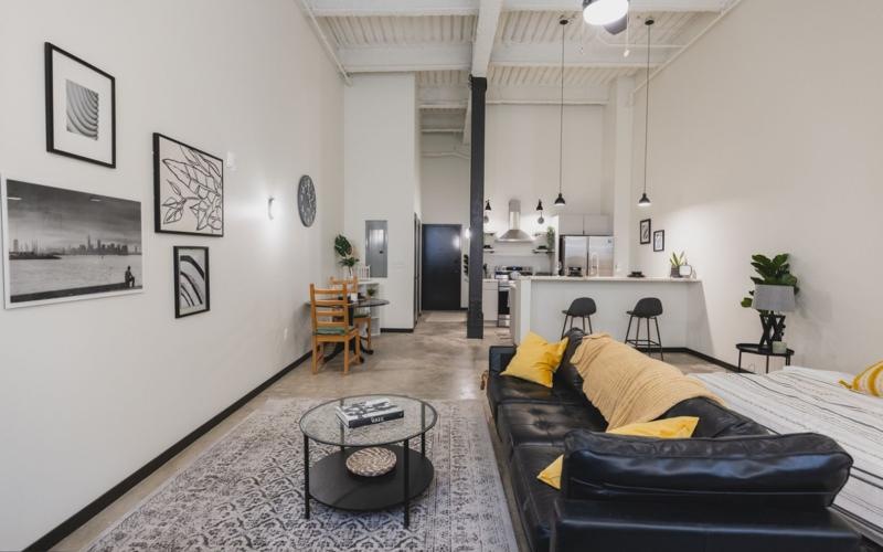 a living room with a couch and a table
