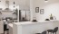 a kitchen with a white counter top