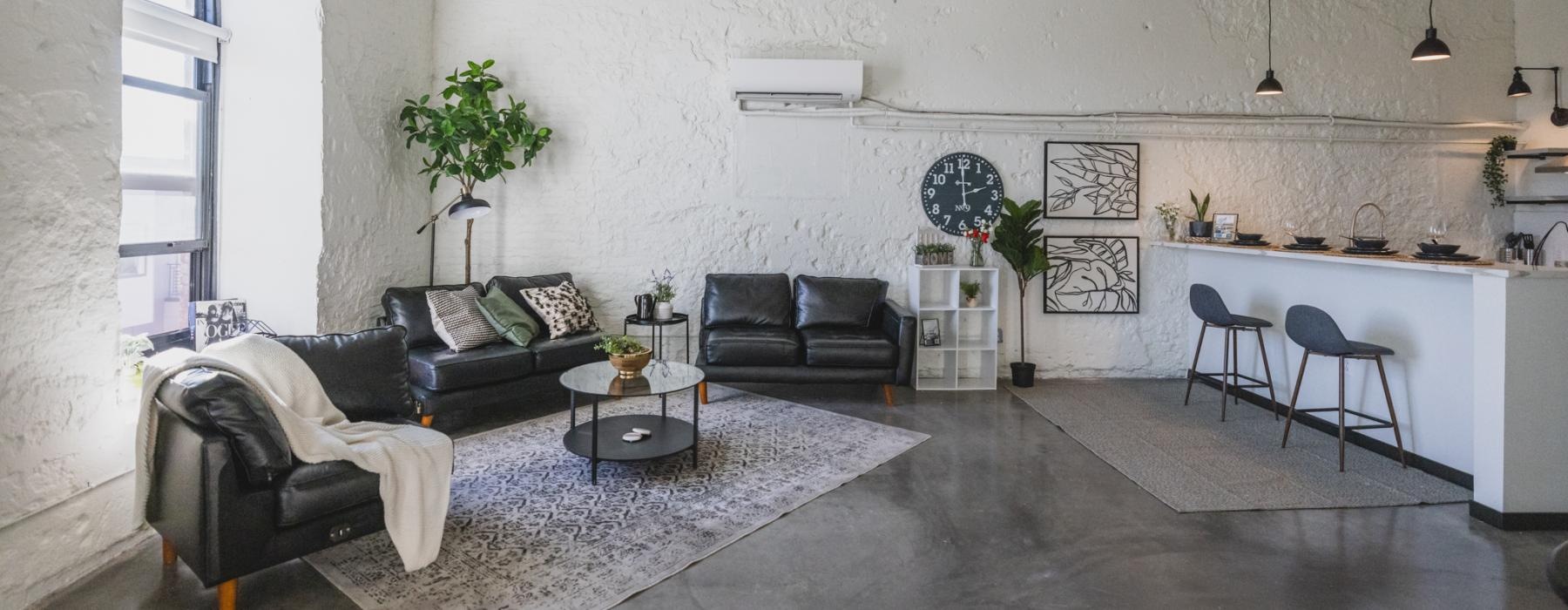 a living room with a couch and a table