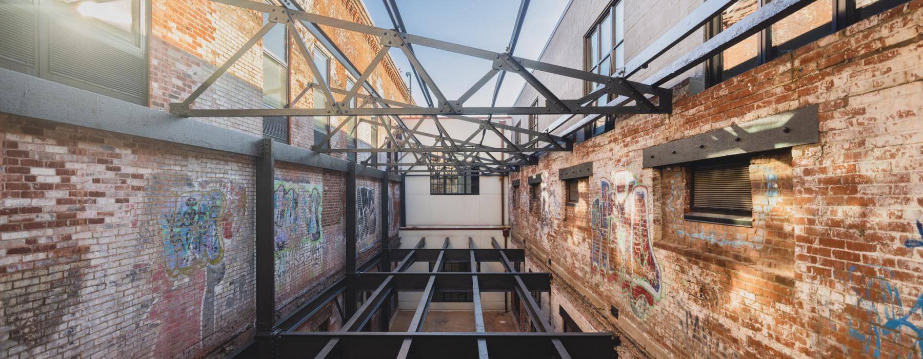 a brick building with graffiti
