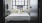 a bed with a flowered pillow
